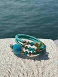 Bracciale con perle in vetro di Murano turchese e oro